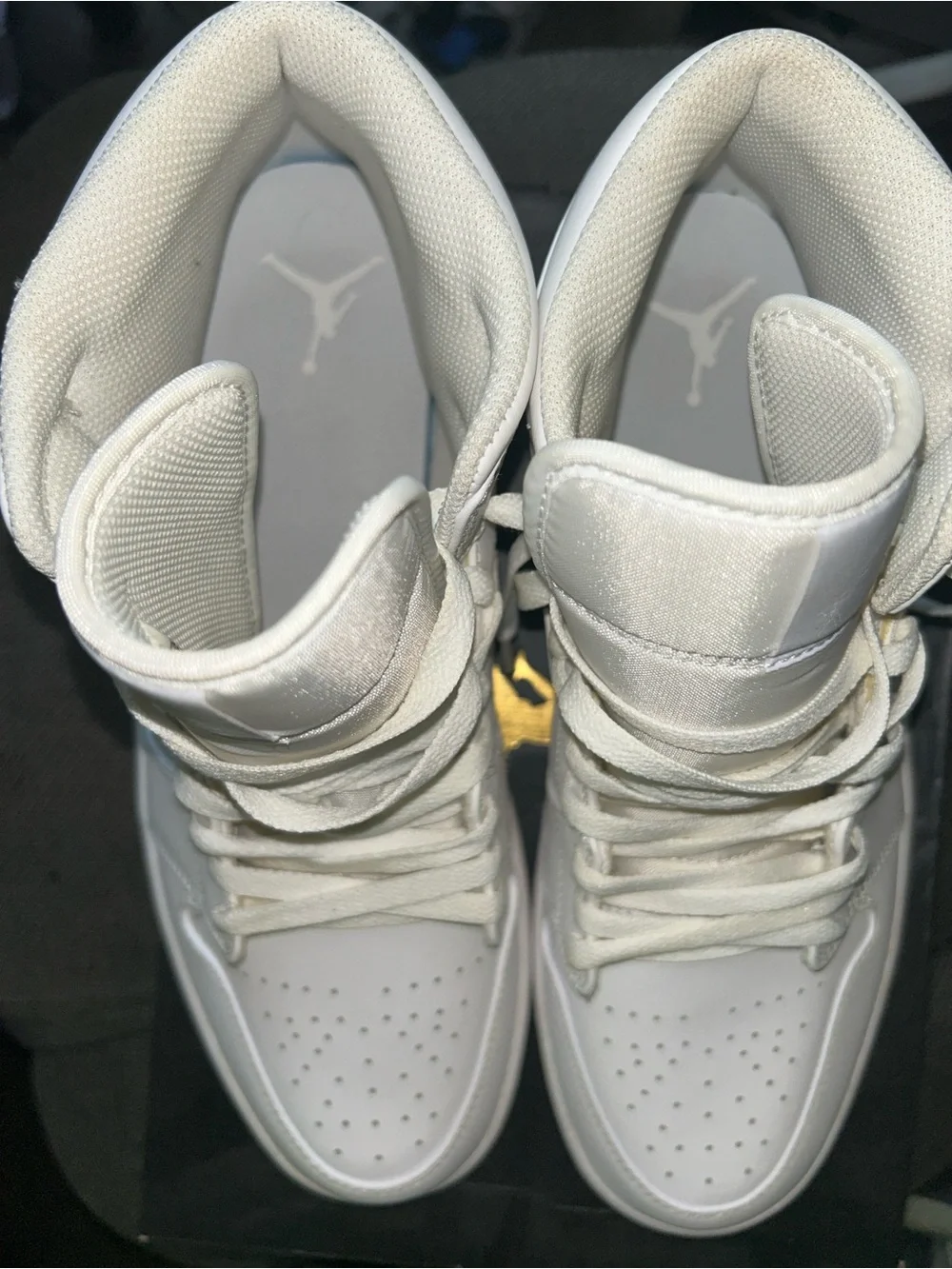 All white Air Jordan 1s mid
